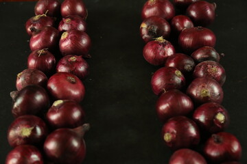 sweet red onions on background