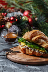 New Year's breakfast with croissants. New Year's croissant with ham cheese and tomatoes. New Year and Christmas concept