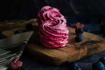 Delicious berry marshmallow. Handmade marshmallow with black currant. Marshmallow with berries on the table