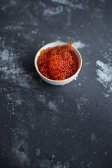 Small plate with red sea caviar.