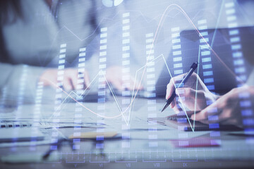 Multi exposure of woman hands typing on computer and forex chart hologram drawing. Stock market analysis concept.