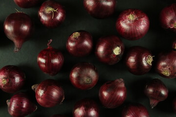 sweet red onions on background
