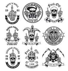 Middle finger emblems set. Monochrome design elements with human skulls showing fuck off hand gesture and text. Nonconformist concept for tattoo, stamp, print templates