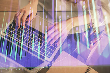 Double exposure of woman hands typing on computer and forex chart hologram drawing. Stock market invest concept.