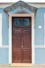 Metal canopy over the entrance of an old house