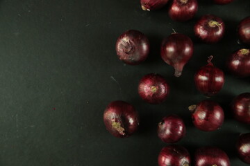 sweet red onions on background