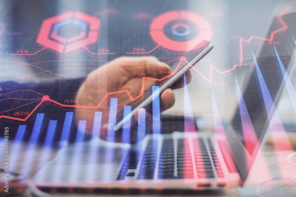 Poster double exposure of man's hands holding and using a phone and financial graph drawing. analysis conce