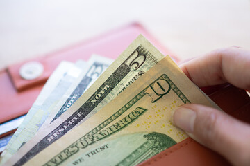 10 dollars in wallet.  Business and financial for money saving concept.
