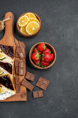 top view yummy cake slices with chocolate and fruits on the dark background cake sweet dessert