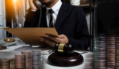 Concepts of Law and Legal services.	Lawyer man working on table office.
