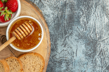top view fresh strawberries with bread and honey on dark background fruit sweet jelly