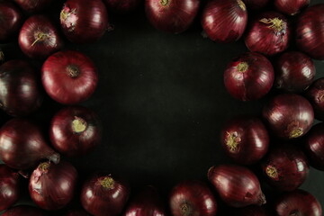 sweet red onions on background
