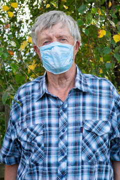 .portrait Of An Elderly Man Wearing A Medical Mask