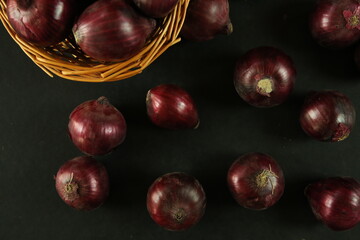 sweet red onions on background