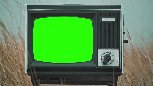 Vintage tv television green screen. Crash Zoom effect into green screen of an old television vintage style.
