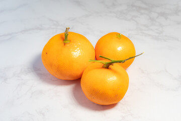 Mandarin oranges on a marble table
