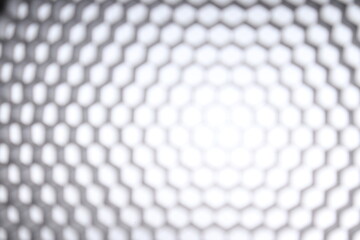 Naklejka premium blurry black honeycomb on white isolated background. diffuser products for photographic light