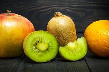 Set of fruits on a vintage black table for composing diet and supply of vitamins