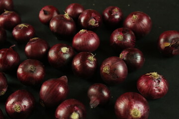 sweet red onions on background