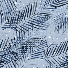 Seamless tropical pattern.Blue palm leaves on a gray background with white polka dots.
