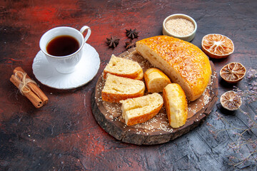 front view yummy sweet pastry with cup of tea on dark background dough pie cake