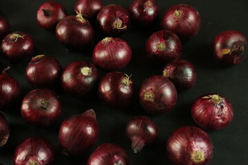 sweet red onions on background