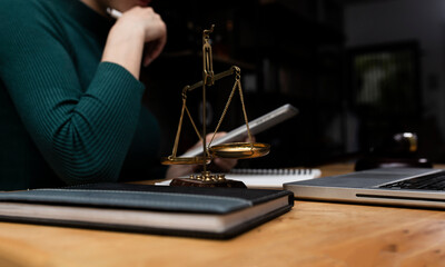 Concepts of Law and Legal services. Lawyer working with digital tablet on table office.