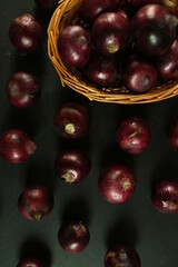 sweet red onions on background