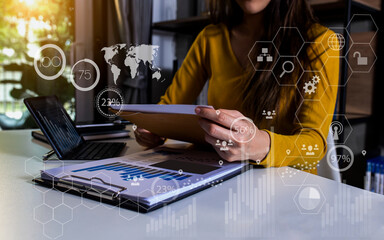 Businesswoman using digital tablet with technology in accounting, finance, data and analytics....