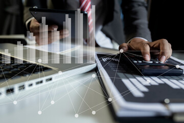 Business hands working on tablet or laptop computer with graphs analysis candle line in office room, diagrams on interface icons screen, Business digital market concept.