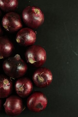 sweet red onions on background