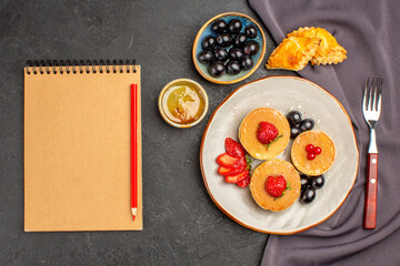 top view yummy pancakes with olives and fruits on dark background sweet fruit cake