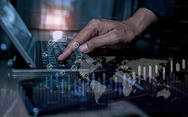 Hands of business people working with documents and digital network and stock exchange market with with graphs analysis candle interface icons on table office. 