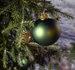 Christmas pine forest. Green and gold christmas balls. New year.