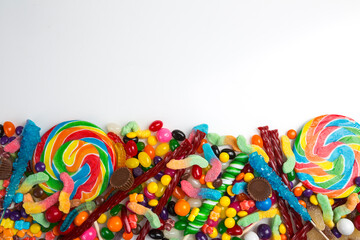Multicolored assortment of candies. Background of sweets and lollipops and colorful array of different treats 