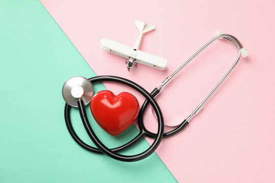 Stethoscope, Heart And Plane On Two Tone Background