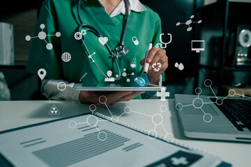 Technology medical network concept. doctor with stethoscope using digital tablet  and laptop and medical futuristic interface icons, 