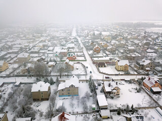 Drone view of the village on a snowy winter day.