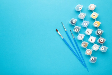 Paints for drawing pictures by numbers on blue