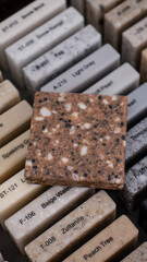 Decorative artificial stone in samples. Suitcase with samples of artificial stone. Finishing material, interior renovation. Gomel / Belarus / 18.12.2020 year