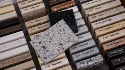 Decorative artificial stone in samples. Suitcase with samples of artificial stone. Finishing material, interior renovation. Gomel / Belarus / 18.12.2020 year