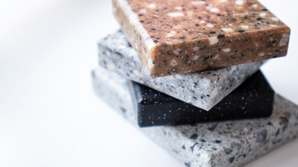 Decorative artificial stone in samples. Suitcase with samples of artificial stone. Finishing material, interior renovation.