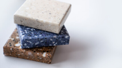 Decorative artificial stone in samples. Suitcase with samples of artificial stone. Finishing material, interior renovation.