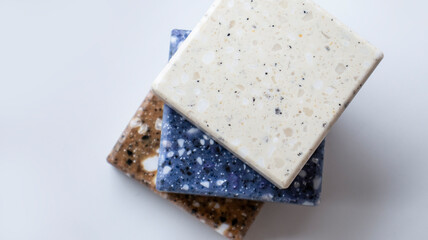 Decorative artificial stone in samples. Suitcase with samples of artificial stone. Finishing material, interior renovation.