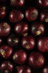 sweet red onions on background