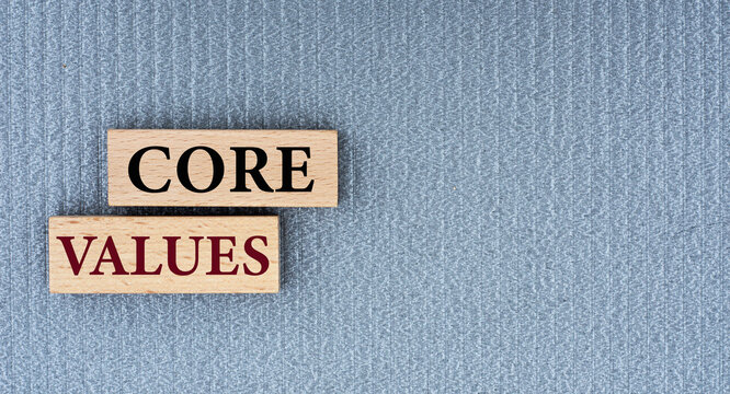 CORE VALUES - words on wooden bars on a gray background with a free space.