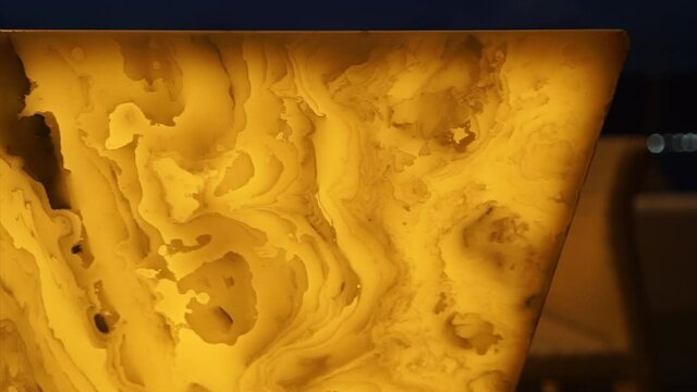 Illuminated alabaster stone texture using as counter bar geature in interior decoration design