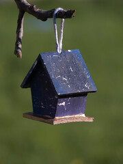 Small wooden house to hang the branches from the trees