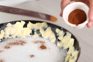 Sprinkle cinnamon powder over sugar layer. Making Apple Tarte Tatin with Cinnamon Series.