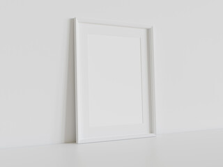 White frame leaning on white floor in interior mockup. Template of a picture framed on a wall 3D rendering